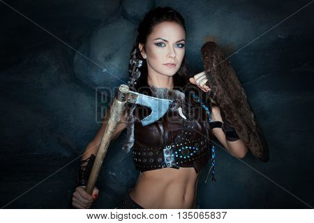 Medieval woman with an ax in his hand she amazon warrior.