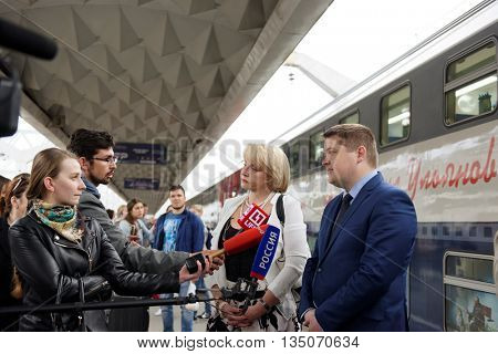 ST. PETERSBURG, RUSSIA - MAY 28, 2016: Deputy director of JSC FPK Stanislav Zotin (right) and President of the Mikhail Ulyanov's foundation Elena Ulyanova talk with press at the double-decker train