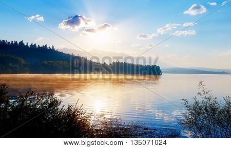 Beautiful lake with mountains in the background at sunrise. Slovakia Central Europe region Liptov