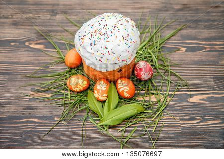 Homemade Easter cake and painted eggs on the table