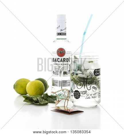 SWINDON UK - JUNE 20 2016: Classic Mojito cocktail in a Kilner Mason Jar with a bottle of Bacardi isolated on a white background