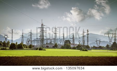 electricity towers and high voltage lines in a nice landscape
