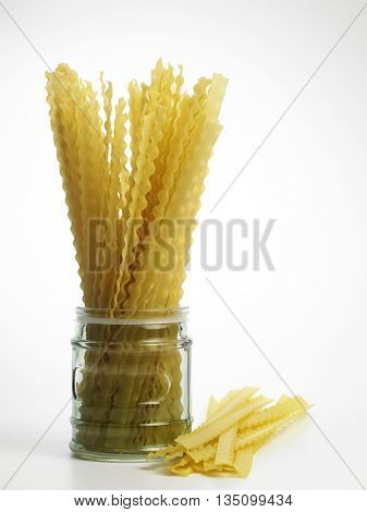 lasagnette in a jar on the white background
