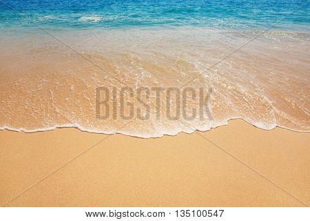 ocean background with soft waves on sandy ground, subtle vintage effect