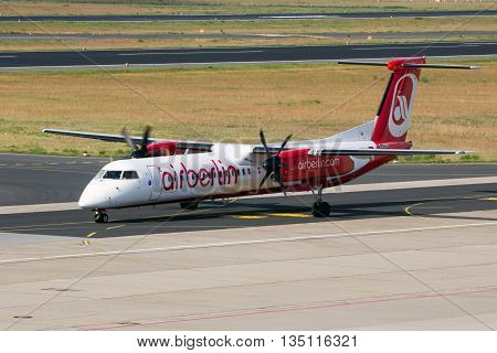BERLIN - JUN 1 2016: Bombardier Q400 from AirBerlin taxiing before take-off at Berlin-Tegel airport