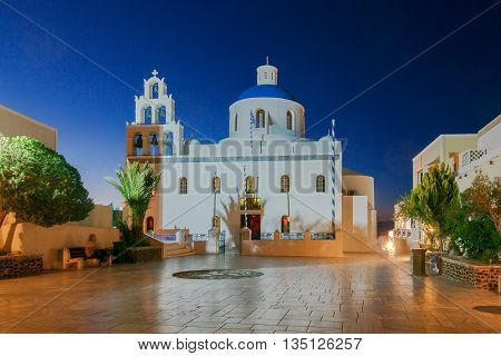 The main white blue orthodox church of Panagia Platsani night. Oia. Santorini.