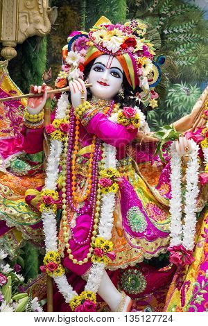Durban, South Africa - March 20, 2016: Hindu God Krishna. Bright colorful sculptural composition. Artistic retouching.