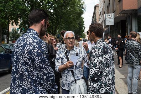 MILAN ITALY - JUNE 18: Fashionable people gather outside Marni fashion show building for Milan Men's Fashion Week on JUNE 18 2016 in Milan.