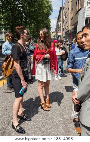 MILAN ITALY - JUNE 18: Fashionable people gather outside Marni fashion show building for Milan Men's Fashion Week on JUNE 18 2016 in Milan.
