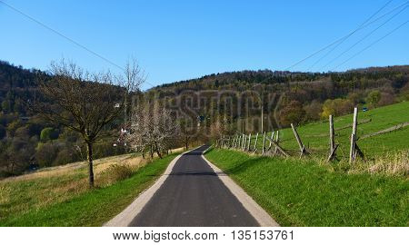 Path and hills in mountains Ceske Stredohori