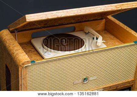 Old Vintage turntable close up, black background