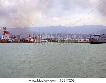 CEBU CITY, CEBU / PHILIPPINES - JULY 30, 2011: A view of Cebu City, as seen from a passenger ferry leaving the island.