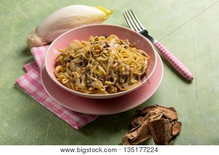 tagliolini with dried mushroom pinenuts and endive salad 