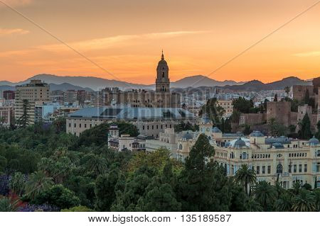 Cityscape and Cathedral at sunset in Malaga Spain.