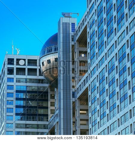 TOKYO JAPAN - NOVEMBER 27 2015: Fuji T.V. headquarters one of the most striking buildings in Japan. its' futuristic metallic clad building featuring a massive silver ball 32 metres in diameter