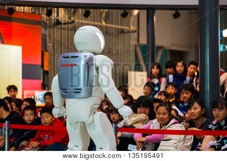 TOKYO JAPAN - NOVEMBER 27 2015: Asimo the humanoid robot created by Honda is presented at Miraikan The National Museum of Emerging Science and Innovation in Odaiba area