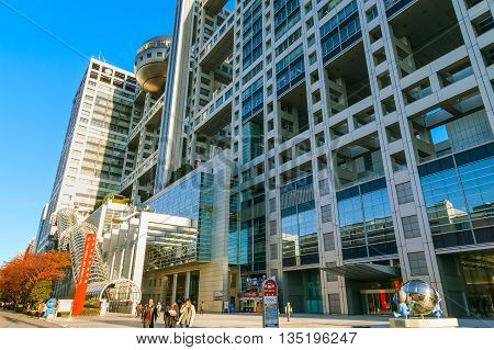 TOKYO JAPAN - NOVEMBER 27 2015: Fuji T.V. headquarters one of the most striking buildings in Japan. its' futuristic metallic clad building featuring a massive silver ball 32 metres in diameter