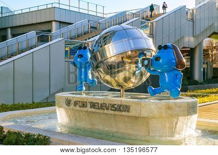 TOKYO JAPAN - NOVEMBER 27 2015: Fuji T.V. headquarters one of the most striking buildings in Japan. its' futuristic metallic clad building featuring a massive silver ball 32 metres in diameter