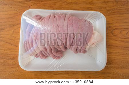 Fresh chitterlings on wood table