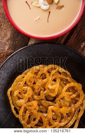 jalebi with rabdi made from condensing milk, famous dessert sweet from India