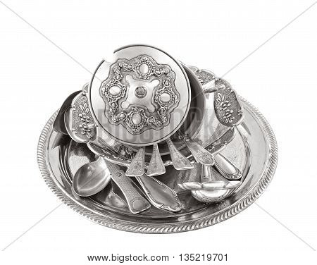 vintage old silverware in a silver tray isolated over white
