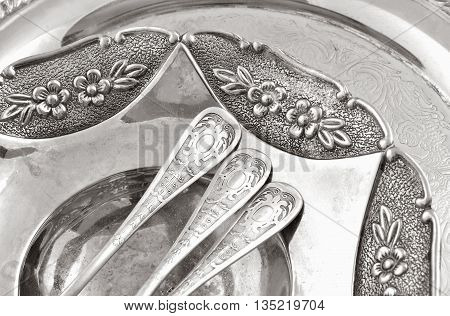 vintage old silverware in a silver tray close-up