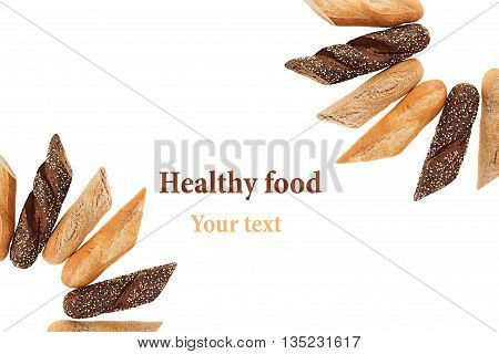 Cut baguette bread of different varieties on a white background. Rye wheat and whole grain bread. Isolated. Decorative frame of bread. Food background. Copy space.