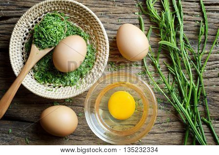 egg and acacia pennata prepare for omelet cooking Thai cuisine - calls that cha-om omelet