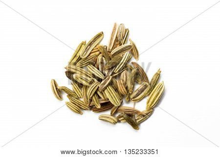 Heap of fennel seed isolated on white background view from above closeup.