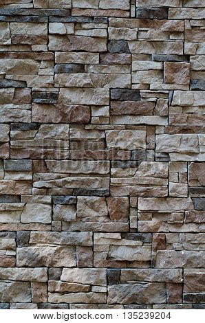 Cladding texture of a stone wall background of natural stone materials