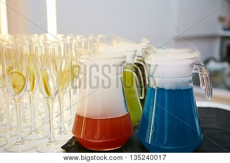 glasses of spritz aperitif aperol red cocktail with orange slices and ice cubes on wood table
