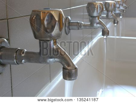 Steel Taps In The Bathroom Of Kindergarteners