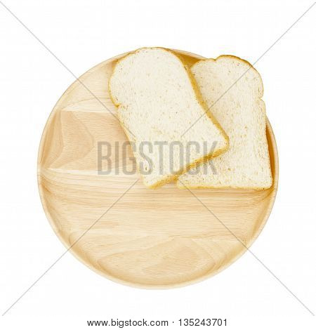 Slice of brown bread on wooden breadboard isolated white background