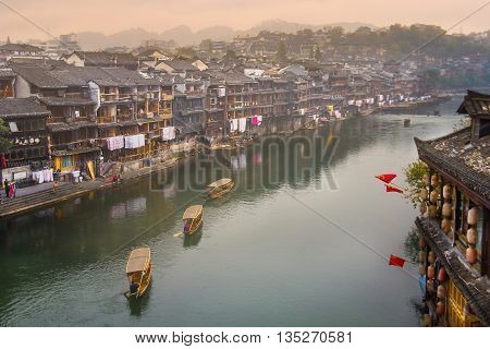 HUNAN, CHINA - OCT 22 : Old houses in Fenghuang county on Oct 22, 2013 in Hunan, China. The ancient town of Fenghuang was added to the UNESCO World Heritage Tentative List in the Cultural category.