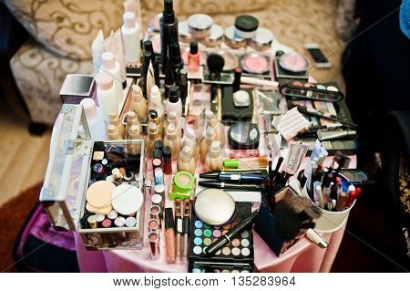 Set Of Brusheslipsticks, Maskara And Eye Shadows. Cosmetics On The Table