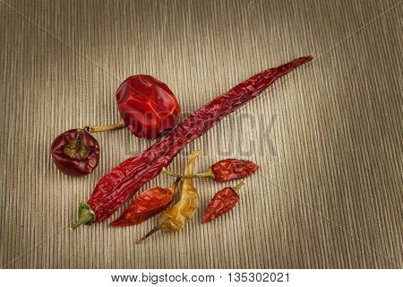 Different kinds of dried chili peppers. Dried red chili peppers. Hot spices to food.