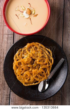 jalebi with rabdi made from condensing milk, famous dessert sweet from India