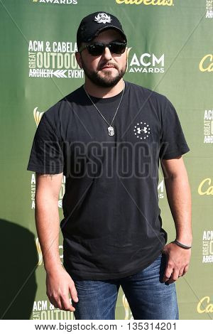 ARLINGTON, TX - APR 18: Tyler Farr attends the ACM & Cabela'??s Great Outdoor Archery Event during the 50th Academy Of Country Music Awards at the Texas Rangers Youth Ballpark on April 18, 2015.