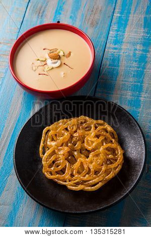 jalebi with rabdi made from condensing milk, famous dessert sweet from India