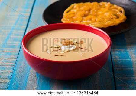 jalebi or imarati with rabdi made from condensing milk, famous dessert sweet from India