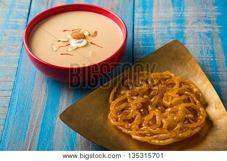 jalebi or imarati with rabdi made from condensing milk, famous dessert sweet from India