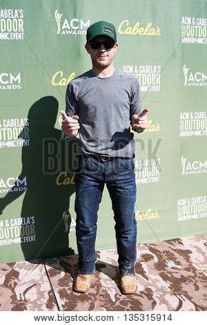 ARLINGTON, TX - APR 18: Justin Moore attends the ACM & Cabela'??s Great Outdoor Archery Event during the 50th Academy Of Country Music Awards at the Texas Rangers Youth Ballpark on April 18, 2015.
