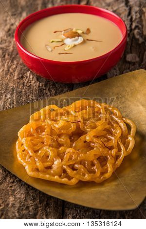 jalebi or imarati with rabdi made from condensing milk, famous dessert sweet from India