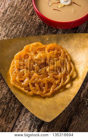 jalebi or imarati with rabdi made from condensing milk, famous dessert sweet from India