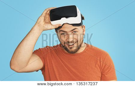 Young man wearing virtual reality goggles, VR Glasses