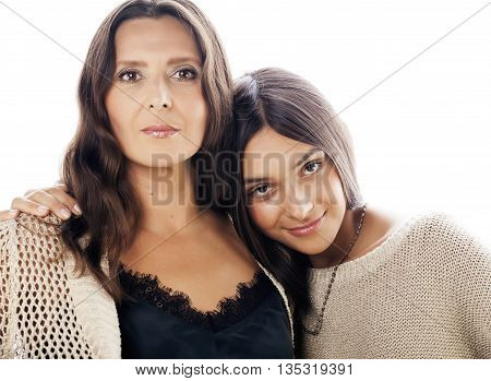 cute pretty teen daughter with real mature mother hugging, fashion style brunette makeup close up tann s, warm colors isolated on white background