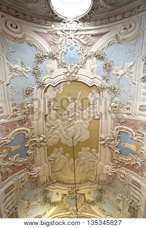 OEIRAS, PORTUGAL - November 4, 2015: The magnificent rococo stucco covering the ceiling of the Chapel of Our Lady of Mercy in the Palace of Oeiras on November 4, 2015 in Oeiras, Portugal