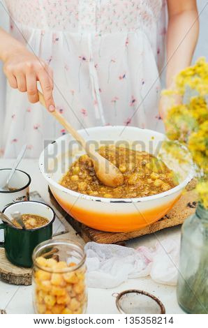 Raspberries Jam. Female Hand Making Jam, On A Rustic White Table
