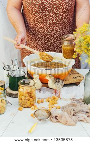 Raspberries Jam. Female Hand Making Jam, On A Rustic White Table