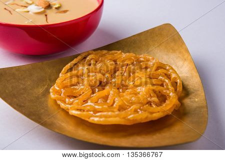 jalebi or imarati with rabdi made from condensing milk, famous dessert sweet from India